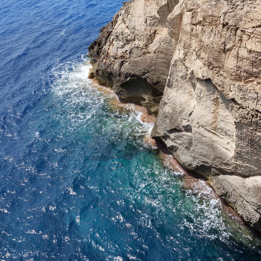 immersion by kuchr — cover art: turquoise sea meeting a pale limestone cliff, seen from above.